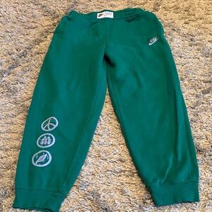 Nike Kids Green Joggers with Fun Graphics extended size L+